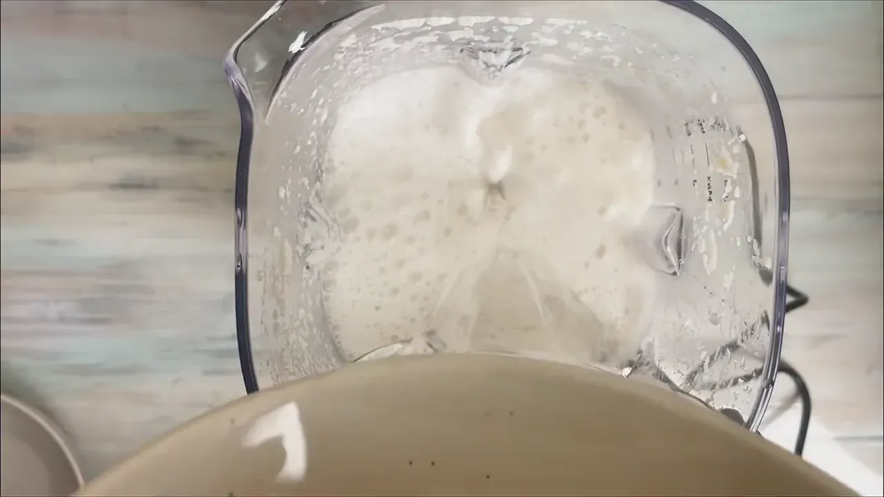 Add the soaked almonds and 1 liter of fresh filtered water to a high-speed blender. Blend on high for 2 full minutes until velvety and completely uniform.