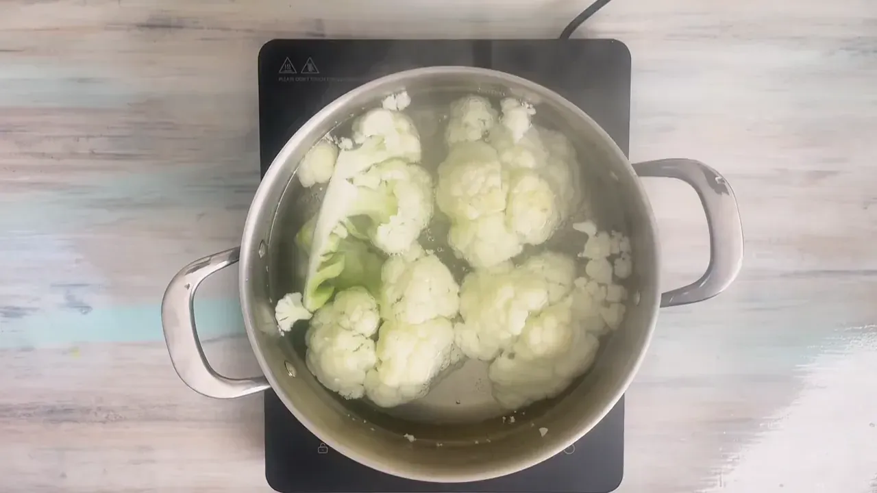 Steam or boil the cauliflower florets until fork-tender, about 10 minutes. Drain thoroughly in a colander and let steam dry for 5 minutes.