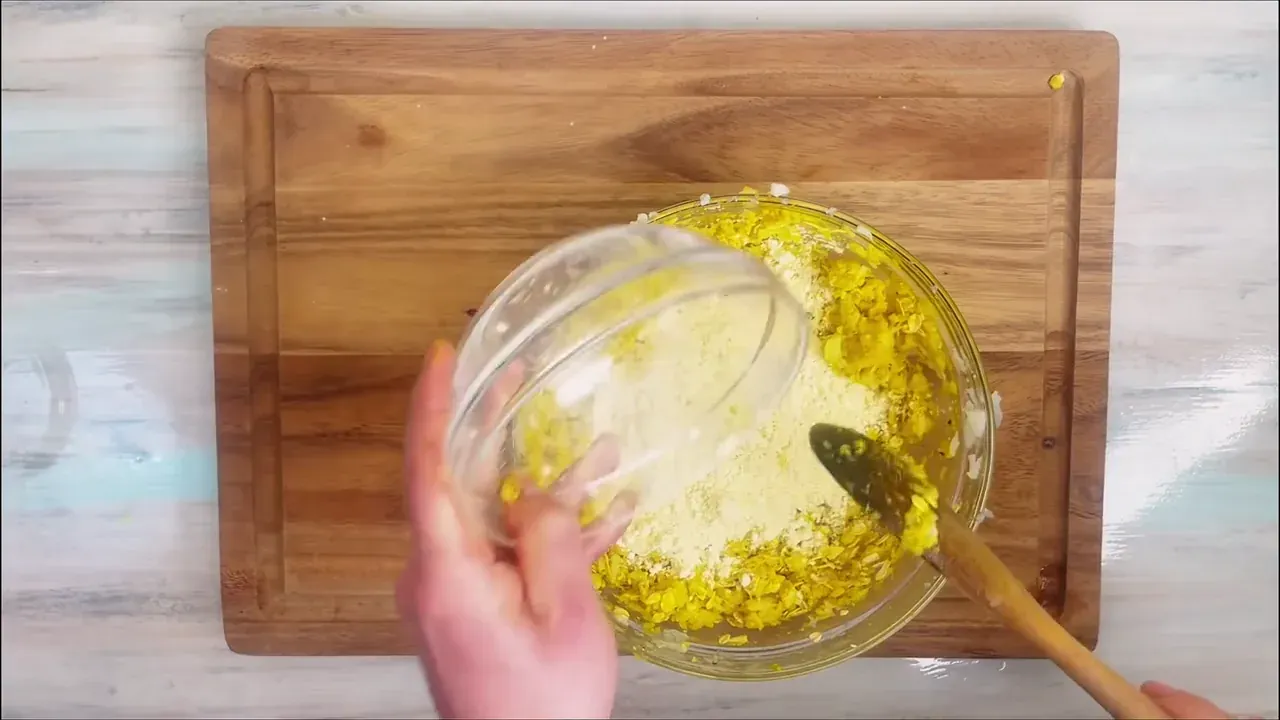 Fold in the oat flour, chickpea flour, black pepper, turmeric, nutmeg, garlic powder, and salt. Stir well and rest the mixture for 10 minutes.