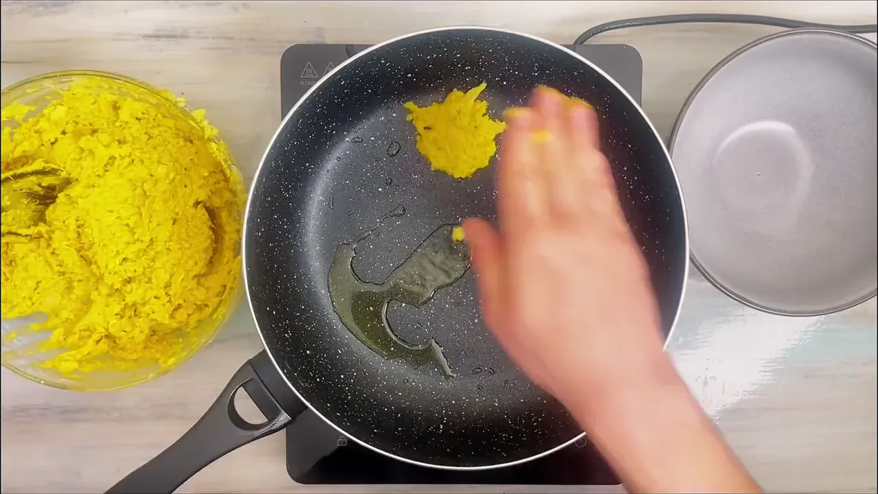 Divide the dough into 12 equal portions and flatten each into a round patty roughly 1.5 cm thick.