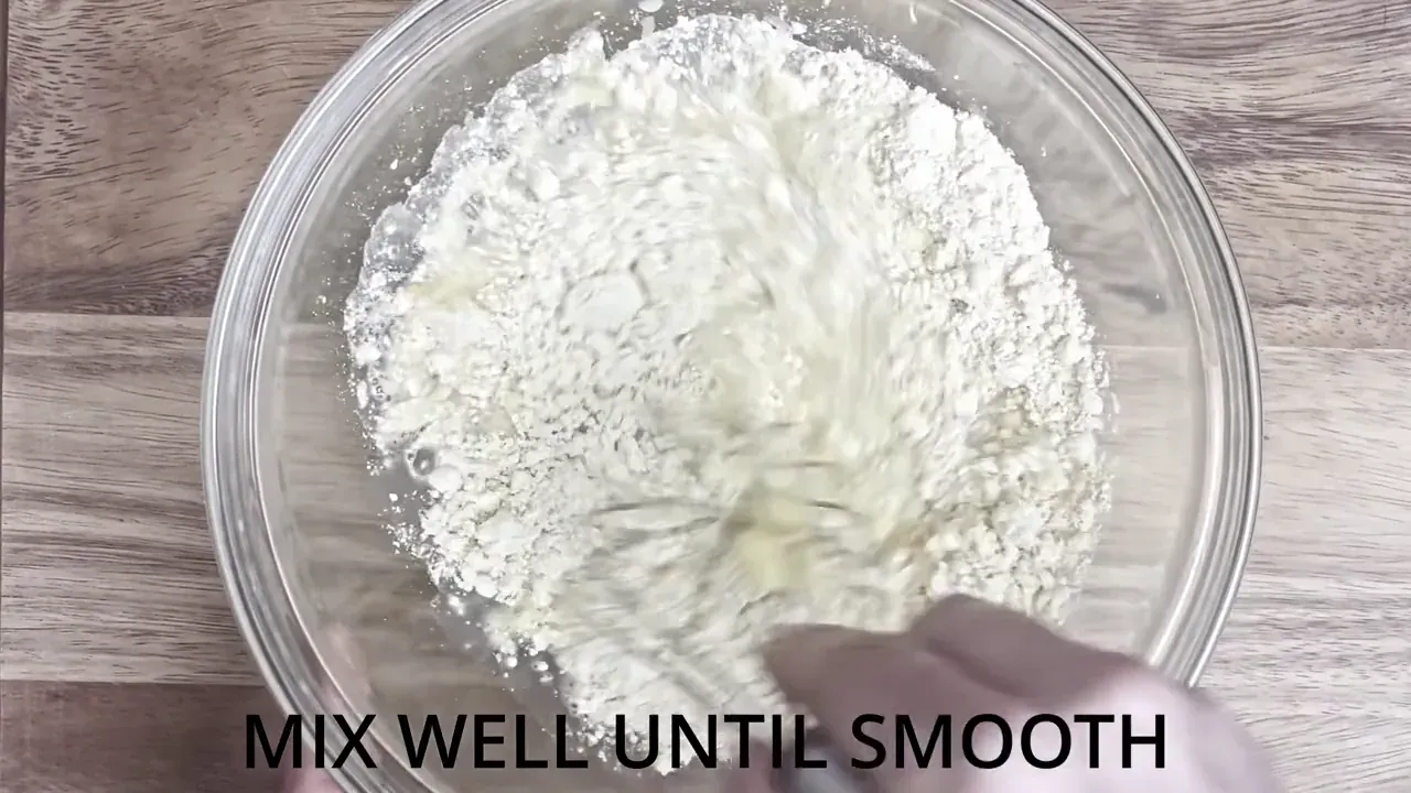 Place the chickpea flour in a bowl, then pour in the water gradually while whisking until completely smooth and lump-free.
