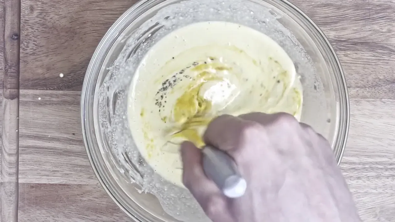 After resting, whisk in the turmeric, black pepper, and sulphurous kala namak black salt.