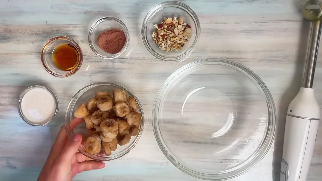 Peel overripe, spotty bananas, slice them into 1-cm rounds, and freeze them in a single layer on a parchment-lined tray for at least 4 hours until solid.