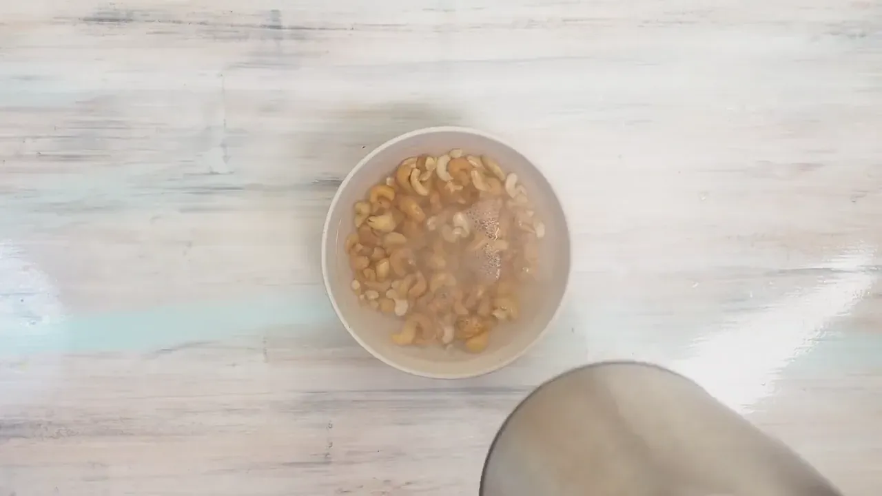 Soak the raw cashews in freshly boiled water for 15 minutes, then drain thoroughly.