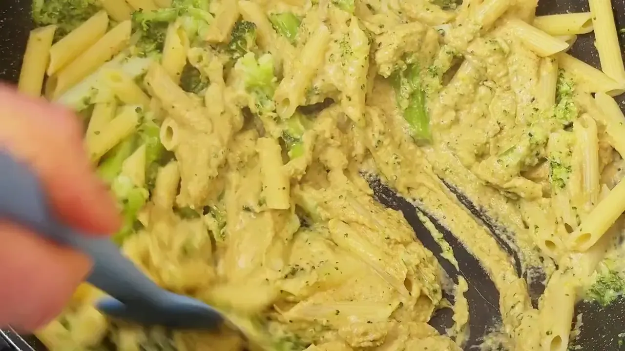 Return the pasta to the warm pan, pour over the broccoli cashew cream, and toss vigorously over low heat. Splash in reserved cooking water until the sauce turns glossy and clings tightly to every ridge.