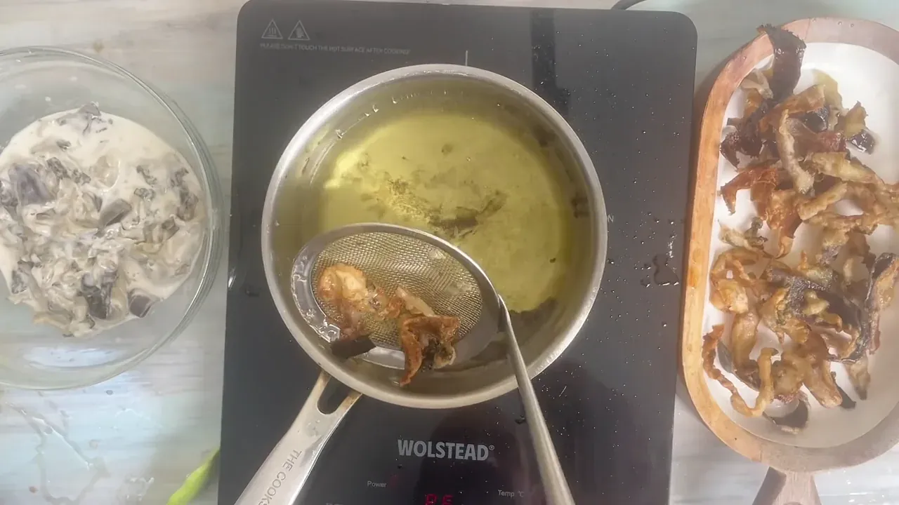 I drain them on a rack or paper towel and serve them hot with lemon and a scattering of fresh parsley.