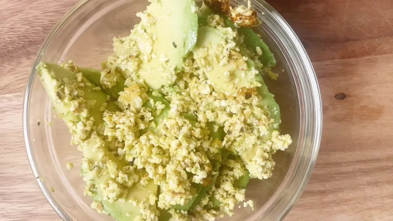 Fold the glazed vegetable soffritto into the warm tofu curds, toss together, and spoon immediately into bowls, alongside ripe sliced avocado.