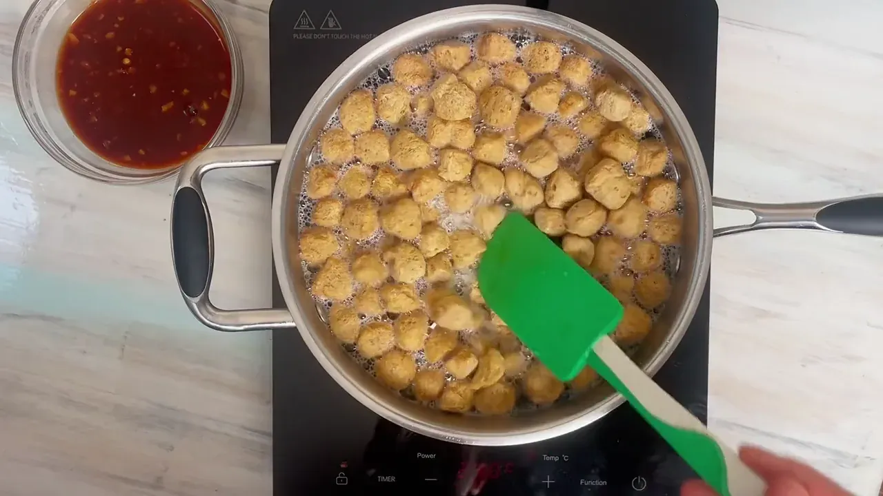 Rehydrate the soy chunks in boiling water for 15 minutes. Drain thoroughly and squeeze very firmly in your hands or clean towel to expel all moisture.