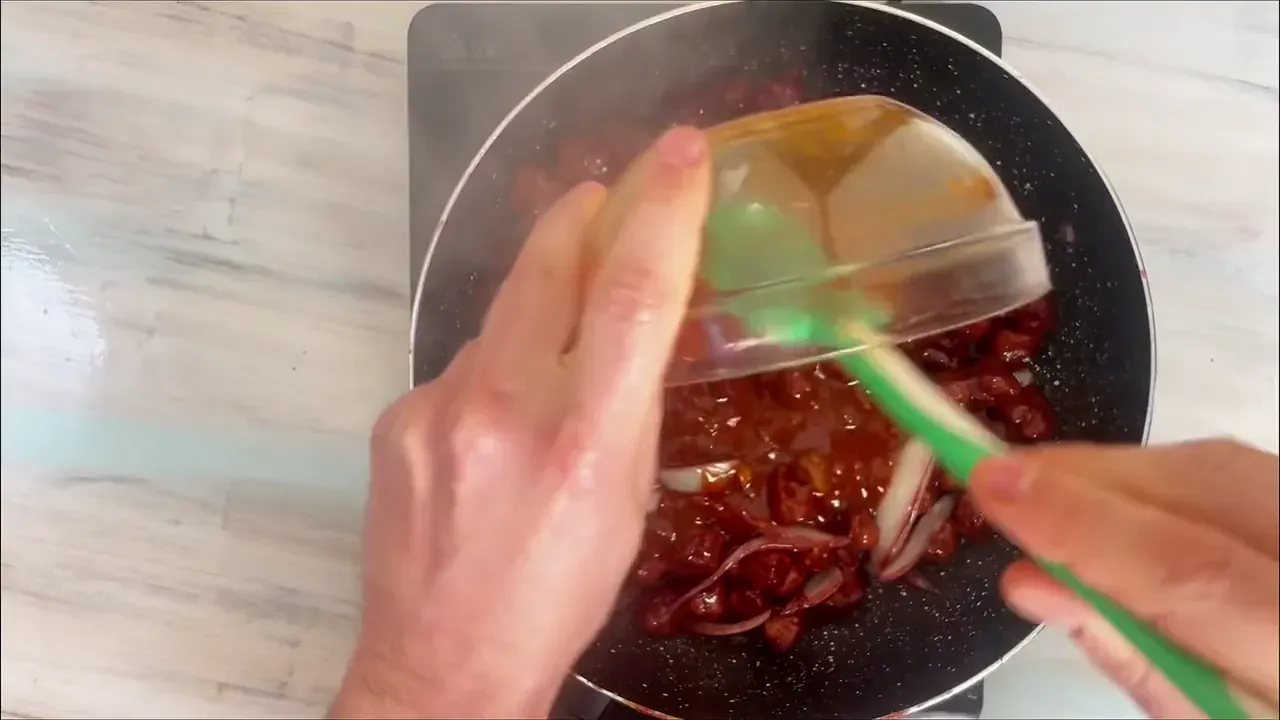Return the browned soy to the pan with the onions. Pour over the whisked sauce and simmer for 5 to 8 minutes, stirring continuously as the glaze thickens and turns intensely glossy.