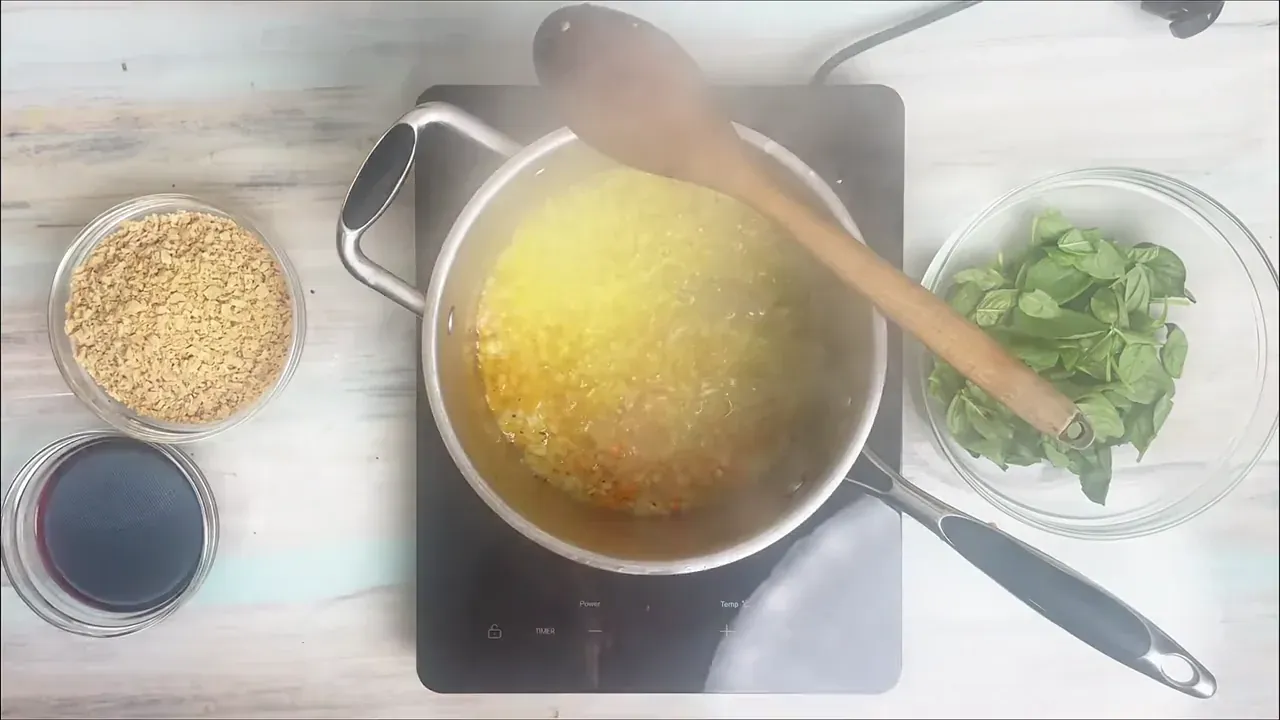 Warm the olive oil in a heavy saucepan or Dutch oven over medium heat. Add the minced soffritto vegetables and sauté gently for 6 to 8 minutes until tender and sweet.