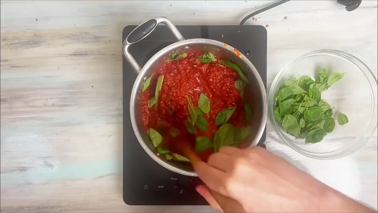 Discard the bay leaves, tear in the fresh basil leaves, and stir to combine. Taste and adjust seasoning with additional sea salt or black pepper if needed.