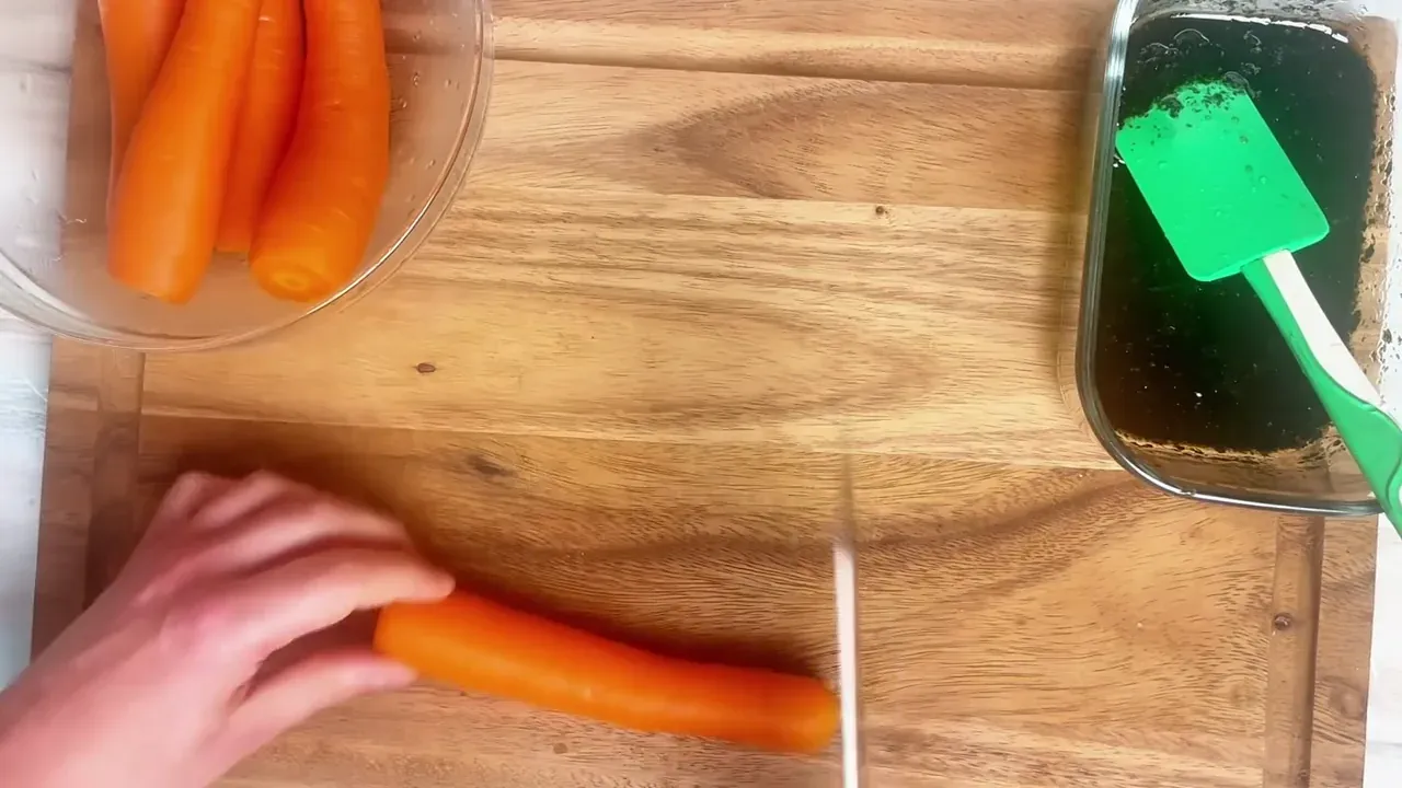 Peel the whole carrots and trim both ends.