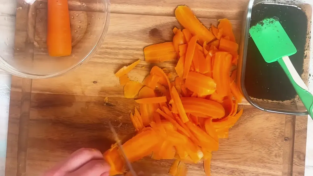 Using a sharp chef's knife or a Y-peeler, slice the carrots lengthwise into long, thin, flexible ribbons resembling smoked salmon fillets.
