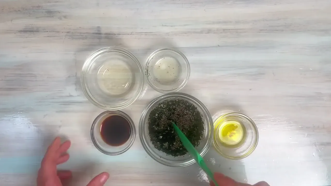 In a small glass bowl or ramekin, whisk together the water, soy sauce, olive oil, lemon juice, salt, and shredded nori.