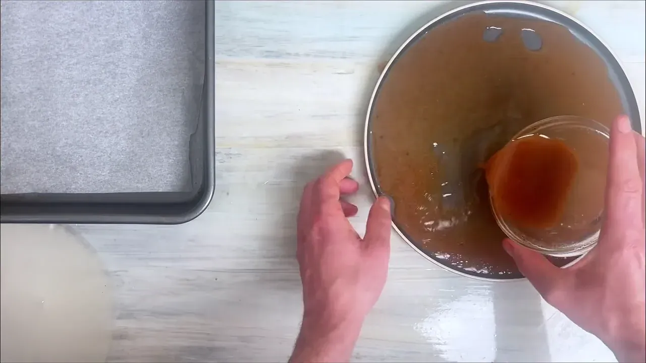 I whisk the warm water, soy sauce, white miso, olive oil, maple syrup, smoked paprika, garlic powder, beet juice, liquid smoke, and black pepper in a shallow dish until completely smooth.