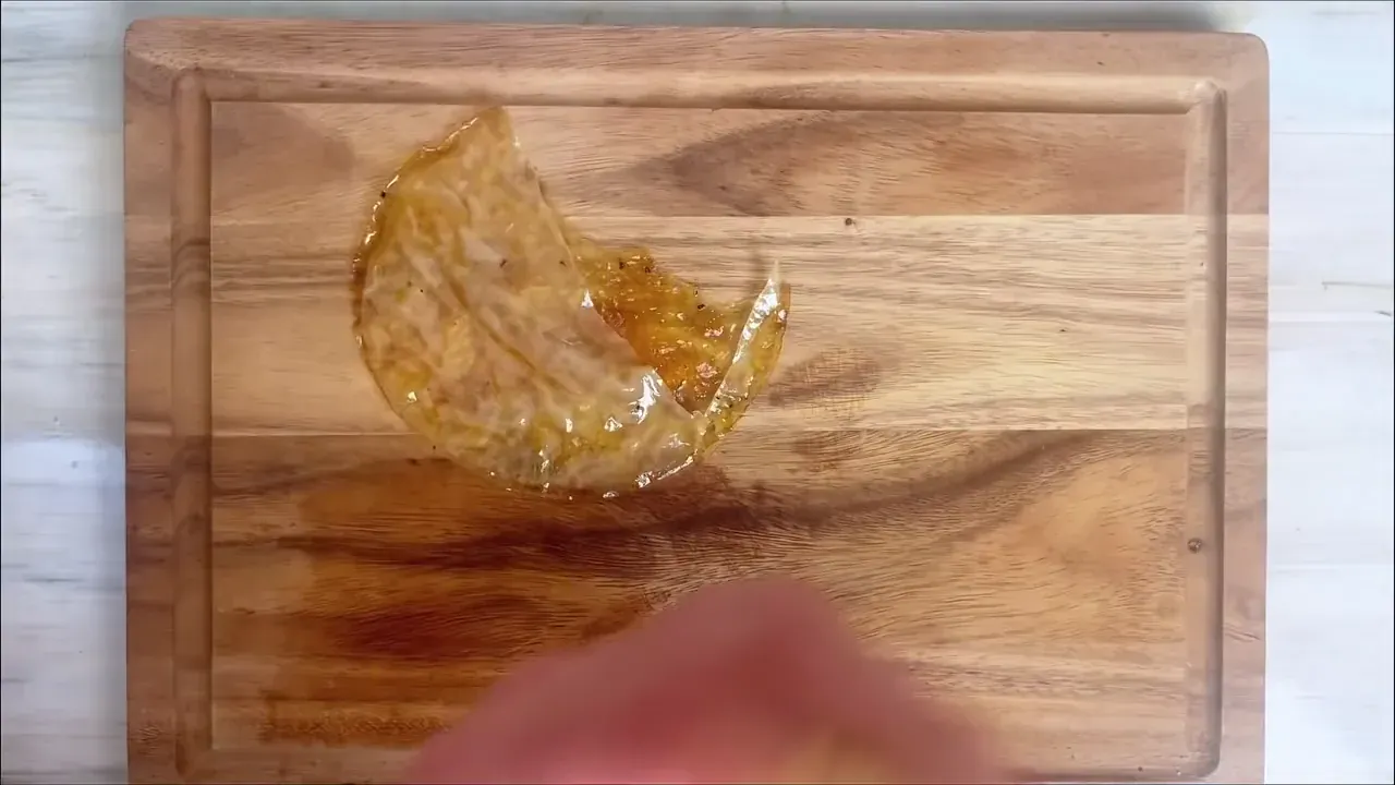 Using kitchen shears or a sharp knife, I cut the paired sheets into long, wavy, uneven ribbons that mimic traditional slices of cured prosciutto.