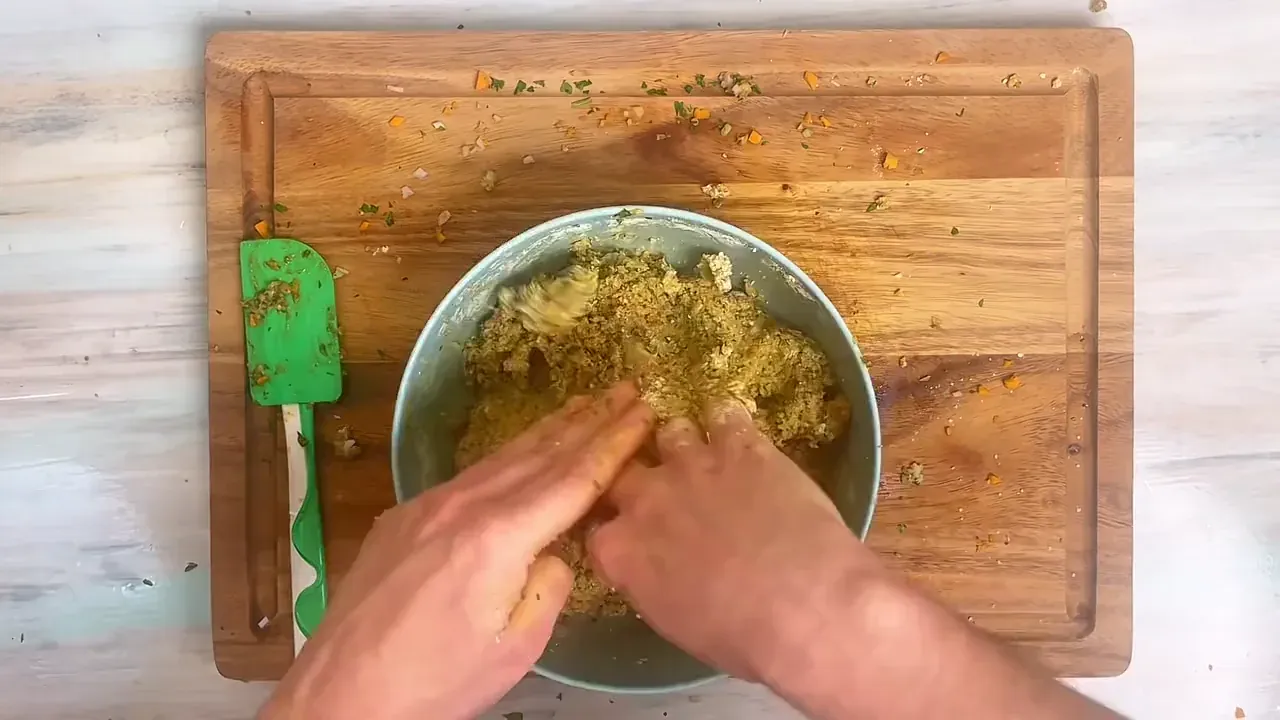 Add the chickpea flour and knead gently with your hands until a soft, pliable, and non-sticky dough forms.