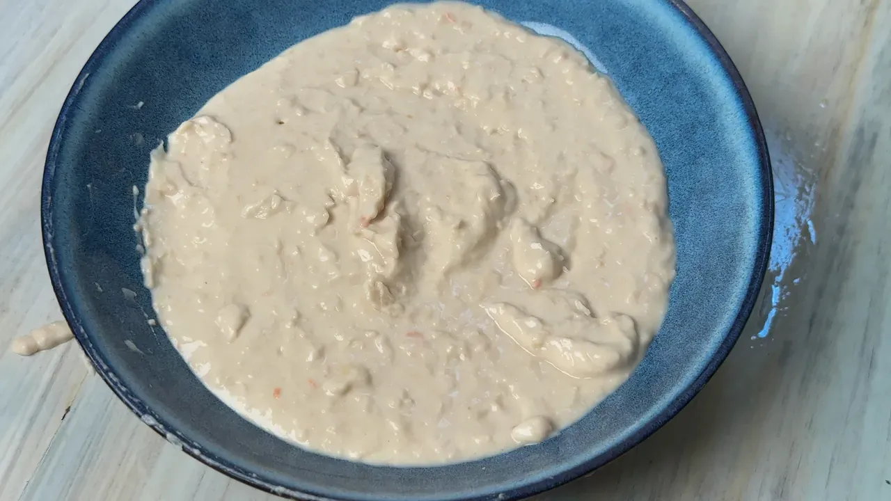 Smooth white bean cream spread in a blue ceramic bowl